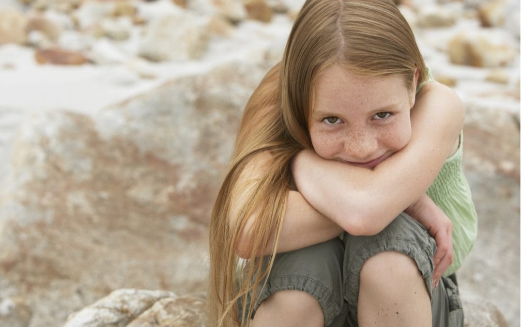 A girl who is happy because she had pediatric cold sore treatment